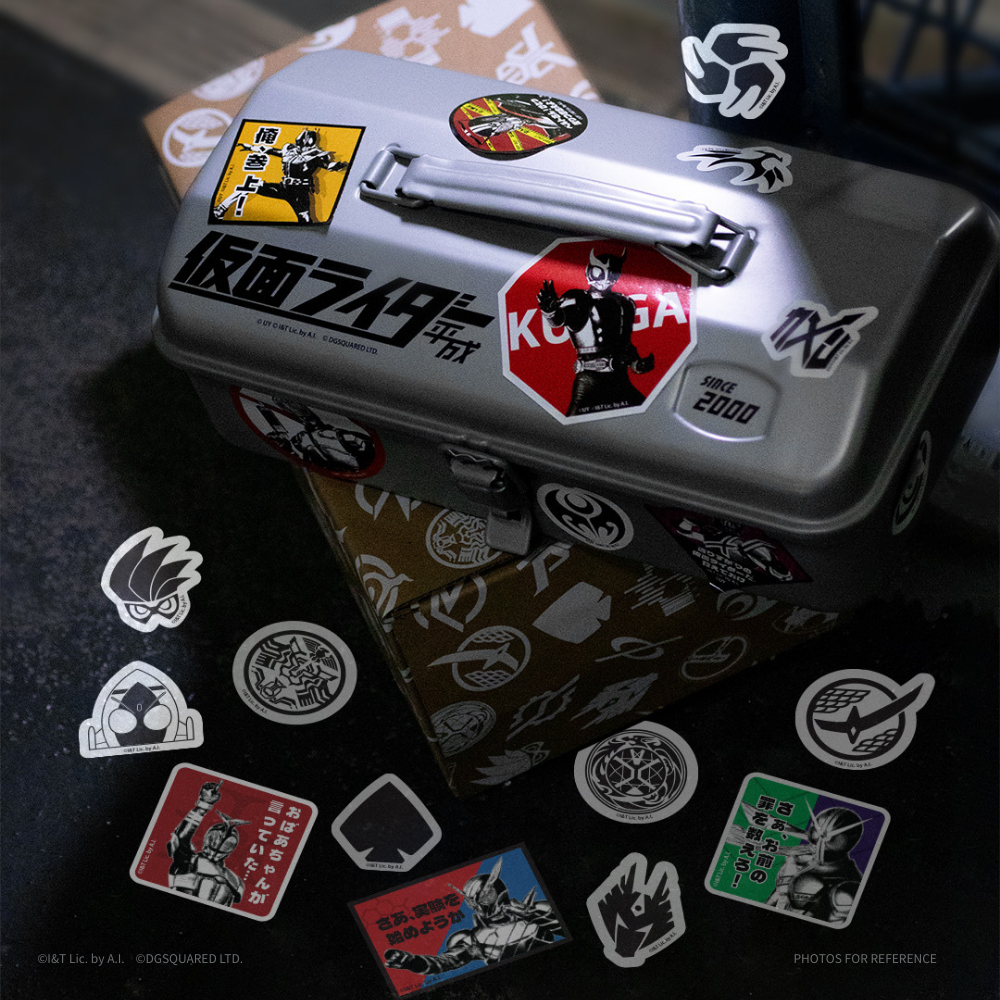 Metal box with stickers featuring a character and text on a dark surface